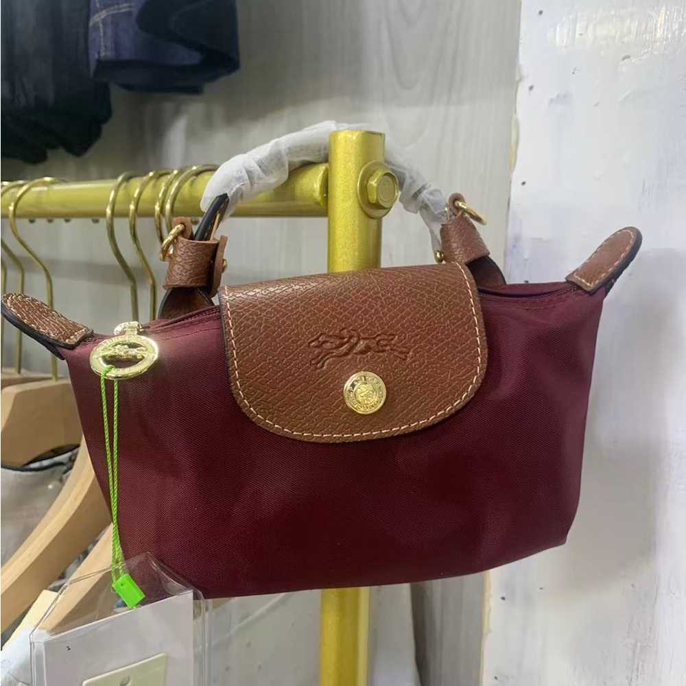 Longchamp mini crossbody in burgundy with brown trim